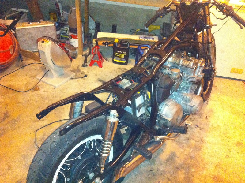 painting with spray paint motorcycle frame